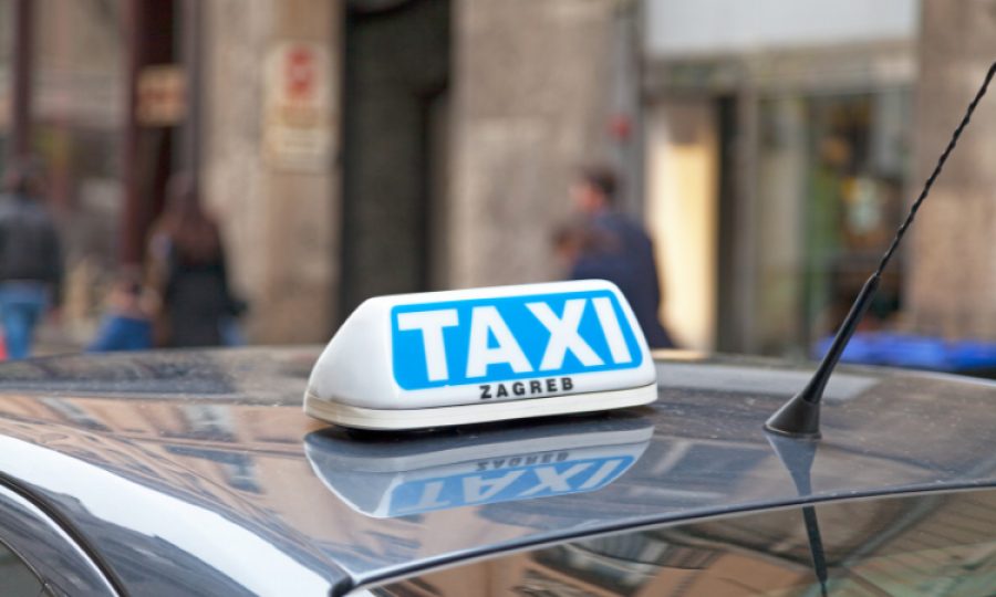 zagreb taxi white and baby blue taxi sign on the roof of a vehicle in Zagreb, Croatia