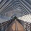bridge surrounded by a modern white polygon structure