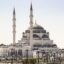 large white mosque with grey details