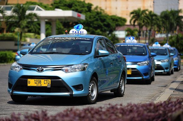 jakarta taxi ocean blue taxis with signature taksi sign on roof
