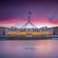 Australian parliament building under a purple sky