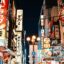 lights, posters, banners and storefront signs in red white yellow and blue