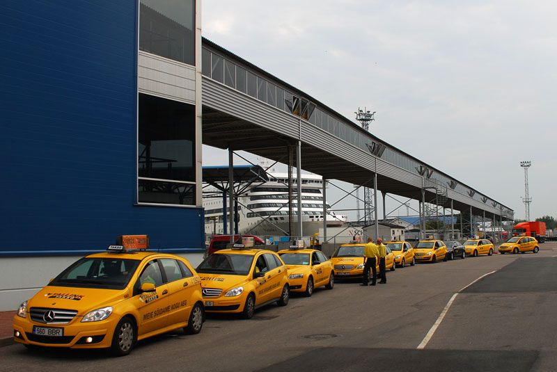 Tallinn taxi yellow coloured taxis with signature roof sign and writting on the sides waiting at a taxi rank