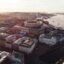 aerial city view with modern and older buildings near body of water