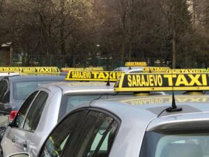Silver taxi roofs with a black and yellow taxi sign on the roof reading 'sarajevo taxi'. Book a Sarajevo taxi from the airport and get to your hotel in no time.