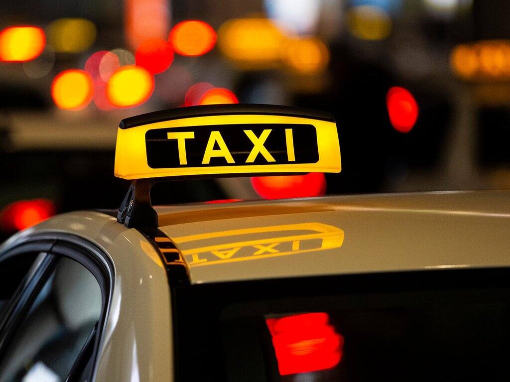 cologne taxi - Welcome Pickups Illuminatred taxi sign on the roof of a Cologne Airport taxi