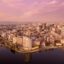 cityscape under a pink cloudy sky