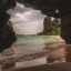 view from inside a cave in the ocean