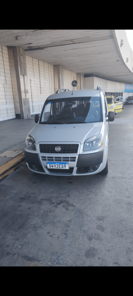 Front view of a silver Rio De Janeiro Airport Taxi (Minivan)