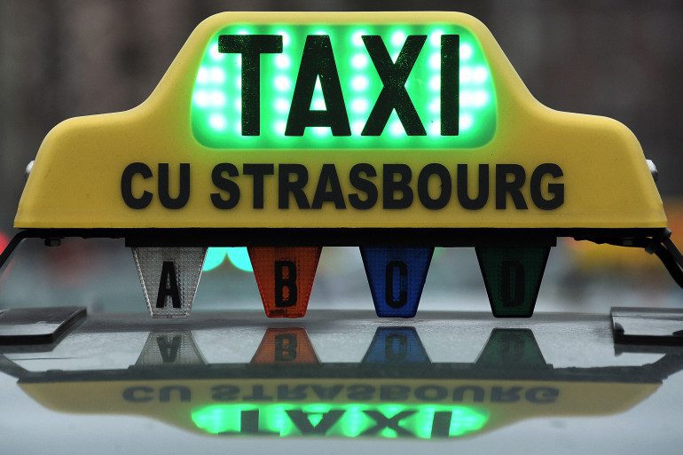 Strasbourg taxi - welcome pickups Strasbourg taxi with an illuminated sign on the roof.