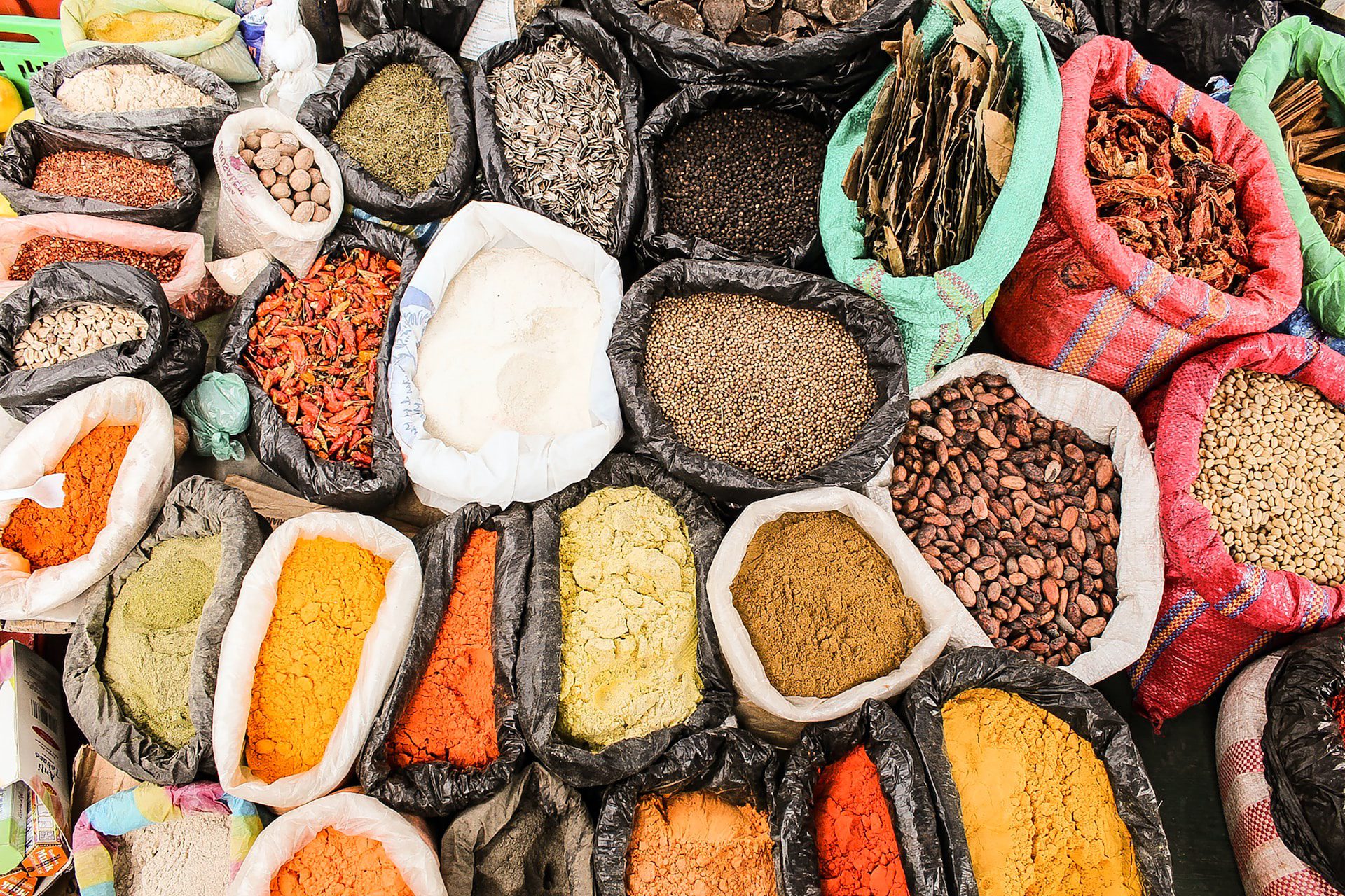 Sacks of colourful spices, herbs and other local products.
