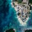 Aerial view of Ksamil surrounded by crystal-clear waters.