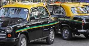 Goa taxi taxi vehicles in Goa, two black vehicles with a yellow roof and two stripes on the sides, one in green, one in yellow