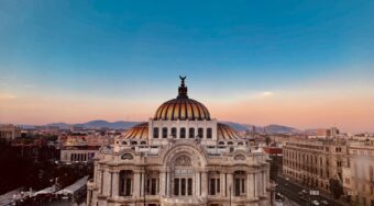 View of Mexico City Centre at dusk, with blue and pink skies above.