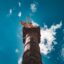 View of a Mexico city monument from below, with blue skies above.
