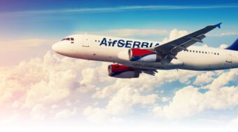 Air Serbia plane flying in the sky.