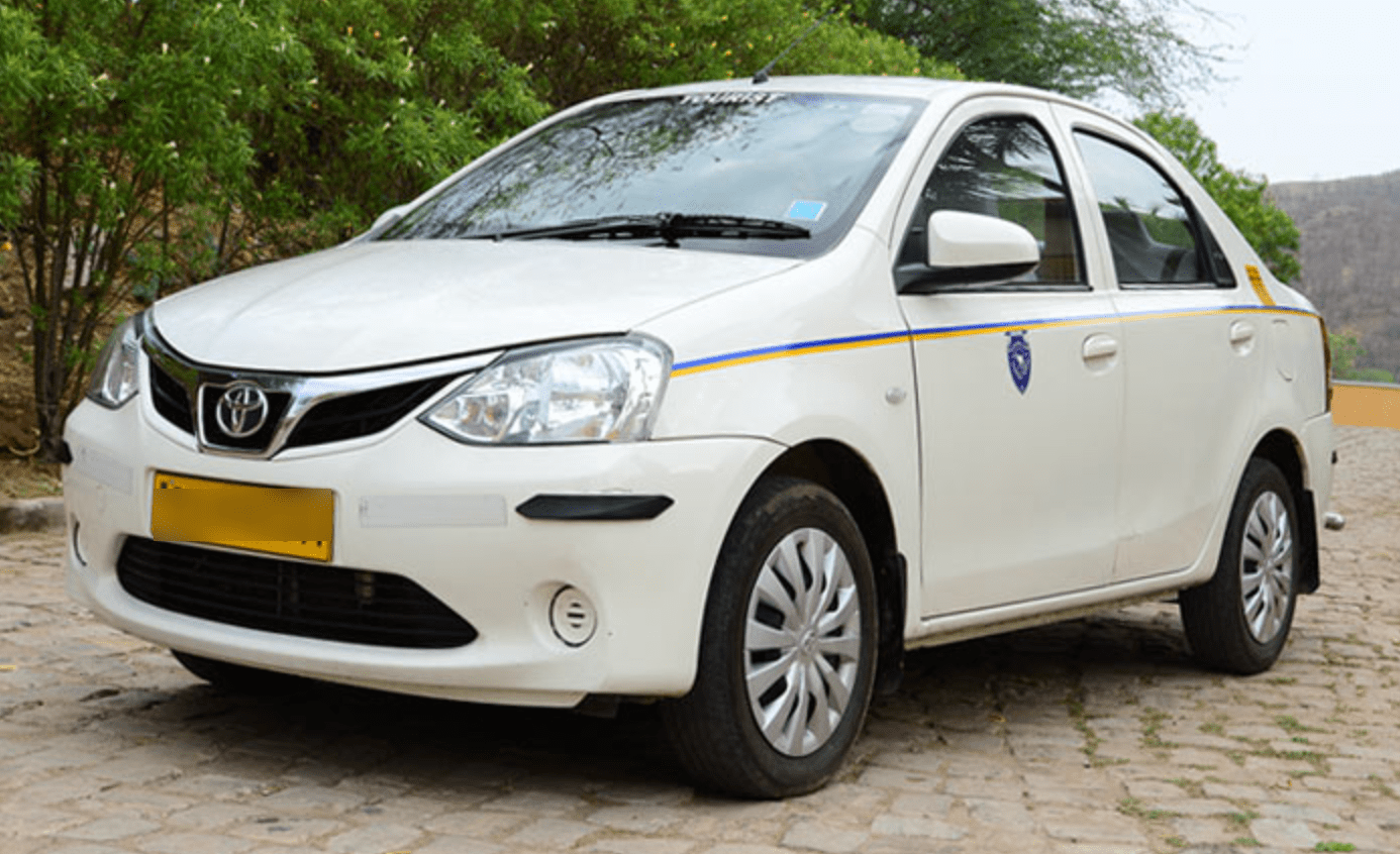Jaipur Airport taxi A white Jaipur Airport taxi.