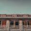 A close up of the front of the Pune Railway Station building.