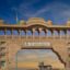 View of Katu Shyam Ji Temple gate, with blue and yellow skies above.