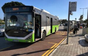 TD4 Bus to Valletta - Welcome Pickups Green and white public TD4 bus at a stop outside Malta International Airport, ready to depart as the Malta Airport to Valletta bus service.