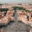 Aerial view of the Vatican City with the rest of Rome in the distance.