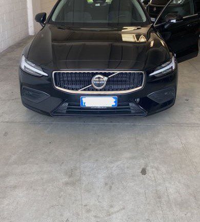 A black Linate Airport Taxi (Sedan) parked in a parking space.
