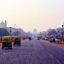 Low traffic street in New Delhi with temples showing in distance
