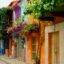 Gorgeous colourful row of homes and flowers in Cartagena, Colombia.