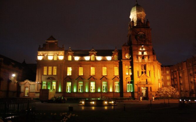 The Clayton Hotel at Dublin Airport lit up at night.