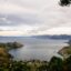 Scenic view of the mountains and waters of Lake Toba under a cloudy sky.