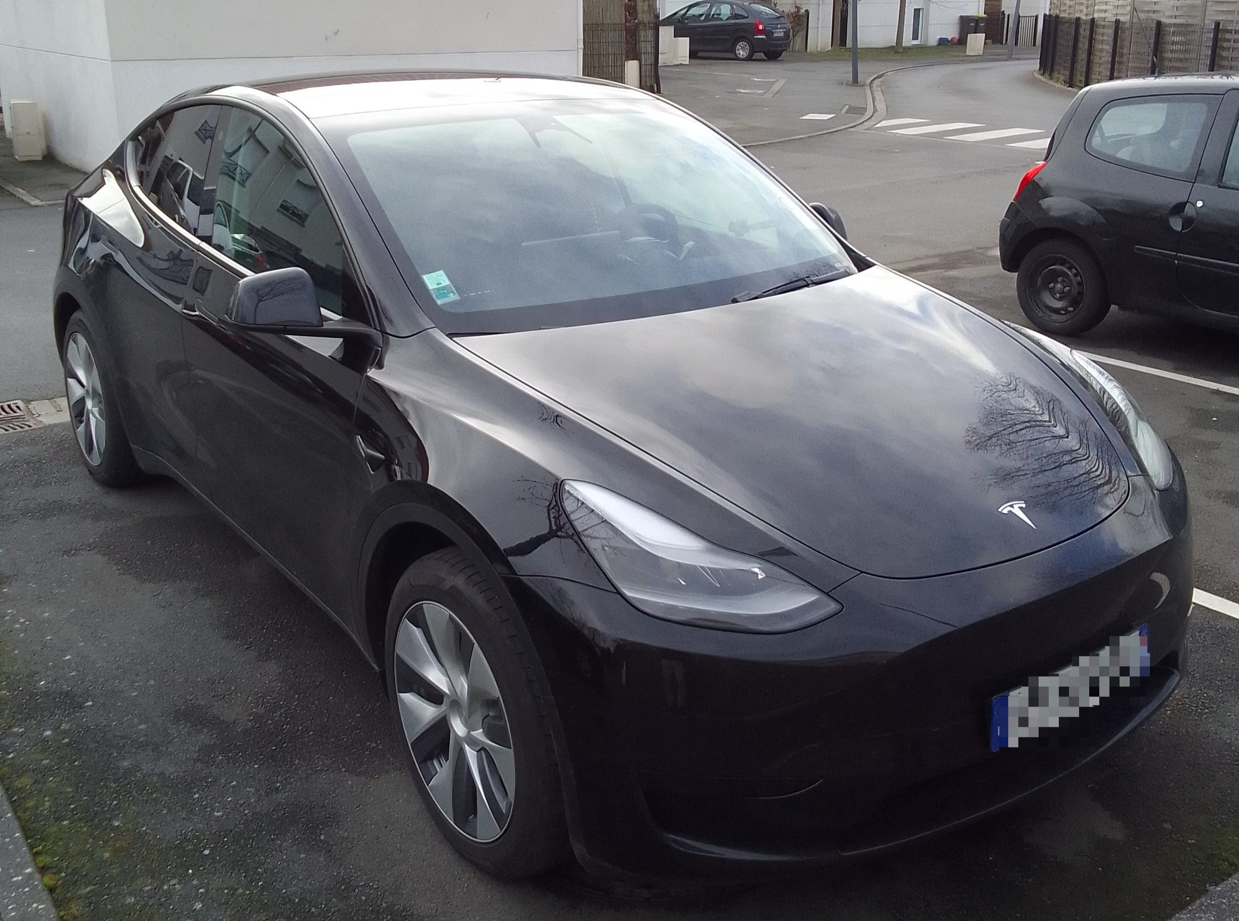 A black tesla located in Lille France, being used as a transfer method around the airport.