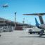 Planes park and fly outside of Rhodes Airport