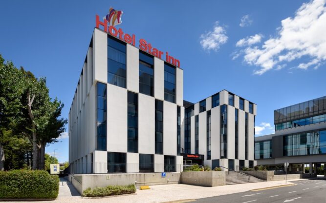 Exterior of Star Inn Hotel, with blue skies above.