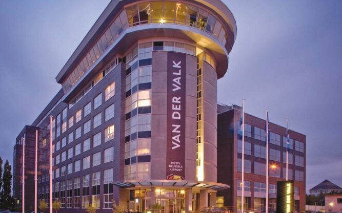 A front view of the Van der Valk Hotel Brussels Airport Hotel at dusk.