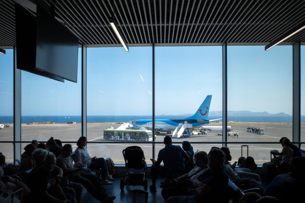 View from inside Heraklion Airport looking to a plane on the runway.