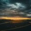 A dark and stormy sunset over the runway at Edinburgh Airport.