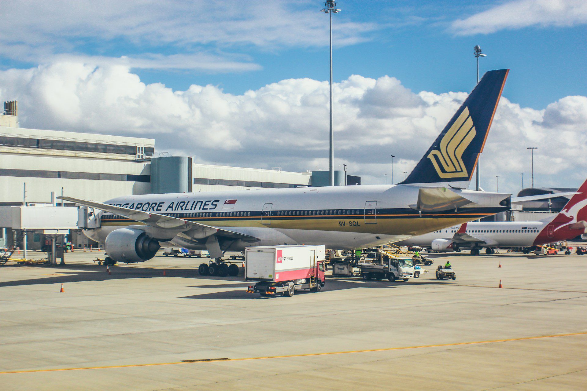 An airplane parked at a gate at Perth Airport.