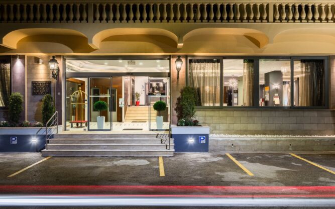 An exterior view at night of the Arion Hotel near Corfu Airport