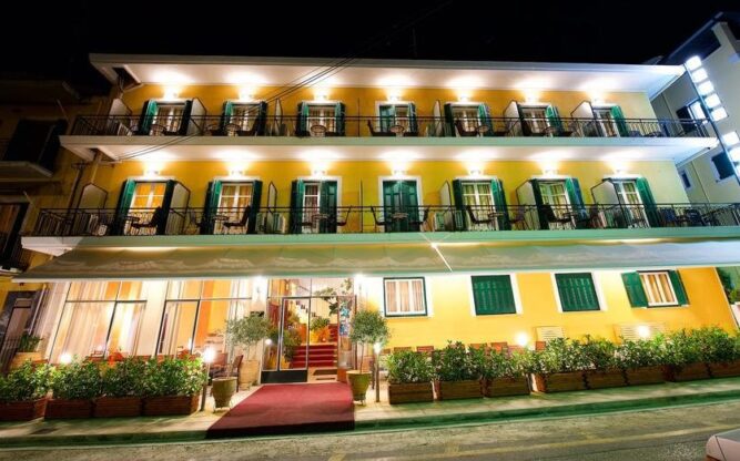 An exterior view at night of the Dalia Hotel near Corfu Airport