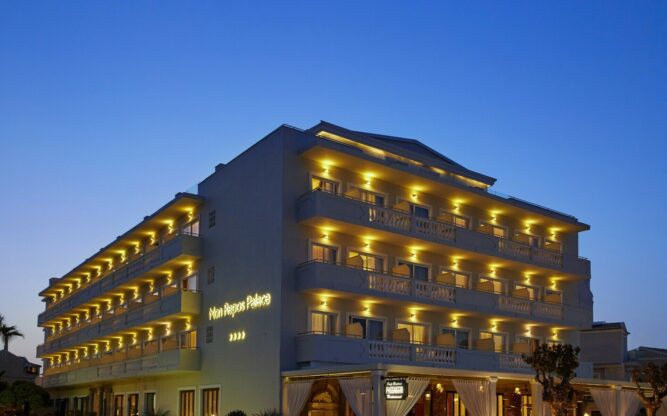 An exterior view at night of Mon Repos Palace near Corfu Airport