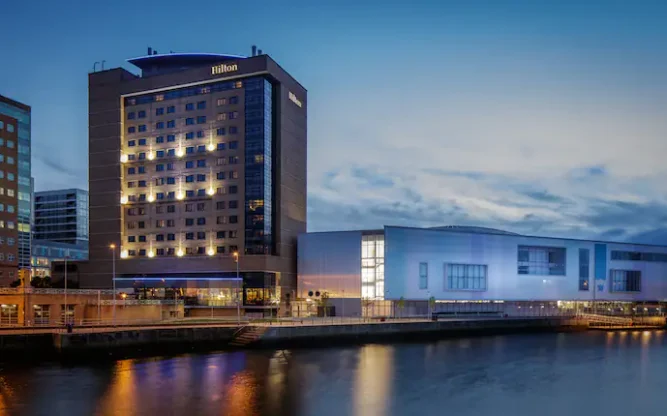 Hilton Belfast on the water at night