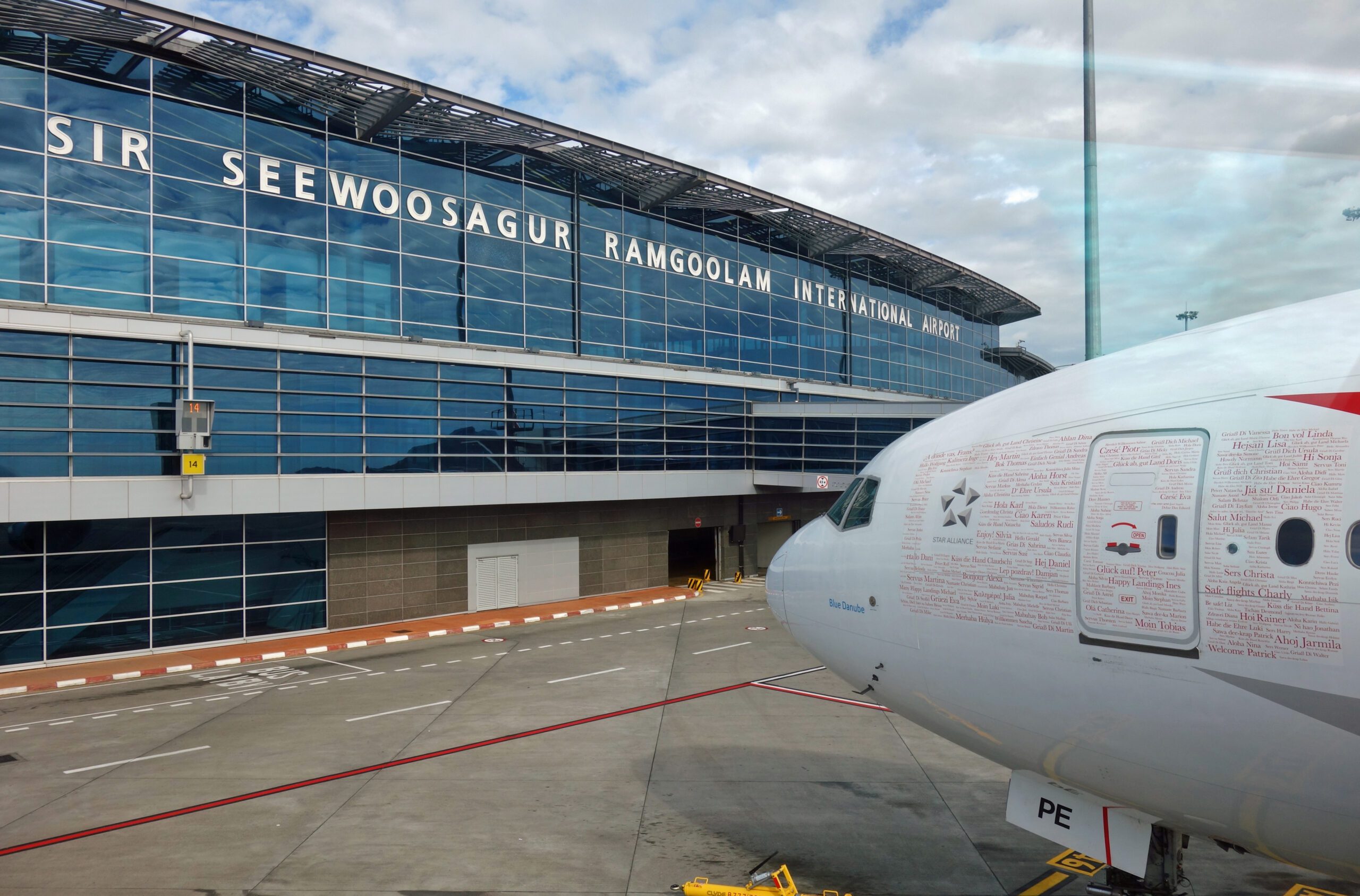 The nose of plane parked at Mauritius Airport Arrivals.
