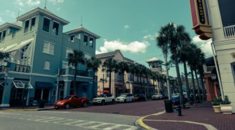 A street in Orlando with cars parked by the sidewalk