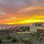 concrete buildings in Tenerife under a yellow and orange sunset