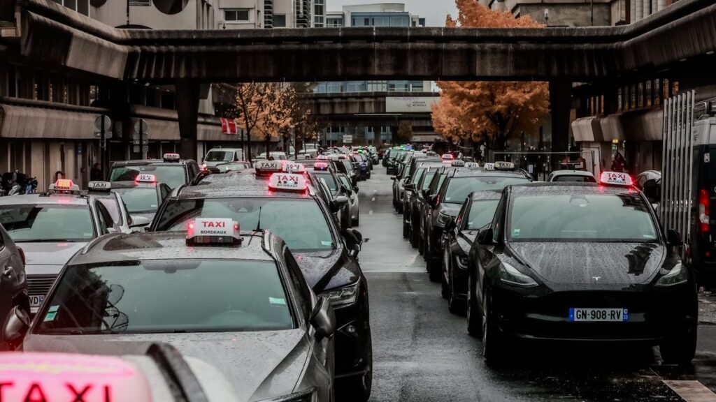 Row of black taxis lining up outside Bordeaux Airport