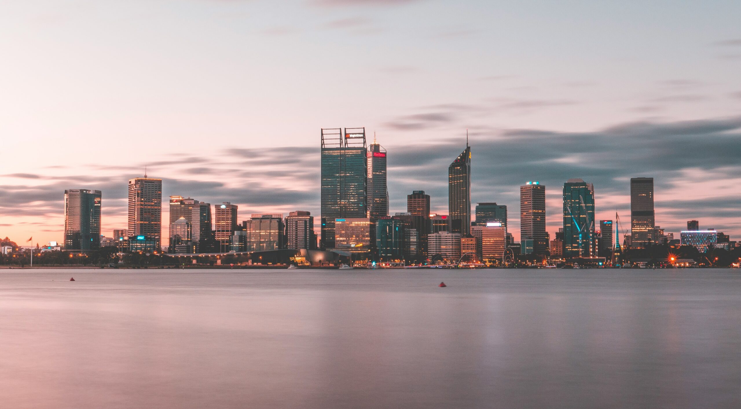 A view of the Swan River at sunset with Perth City in the background