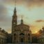 A large building with a clock in the middle of it in Gijón, Spain