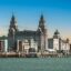 A view of the River Mersey with Liverpool city center in the background.