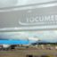 Tocumen International Airport signage with a plane preparing for takeoff.