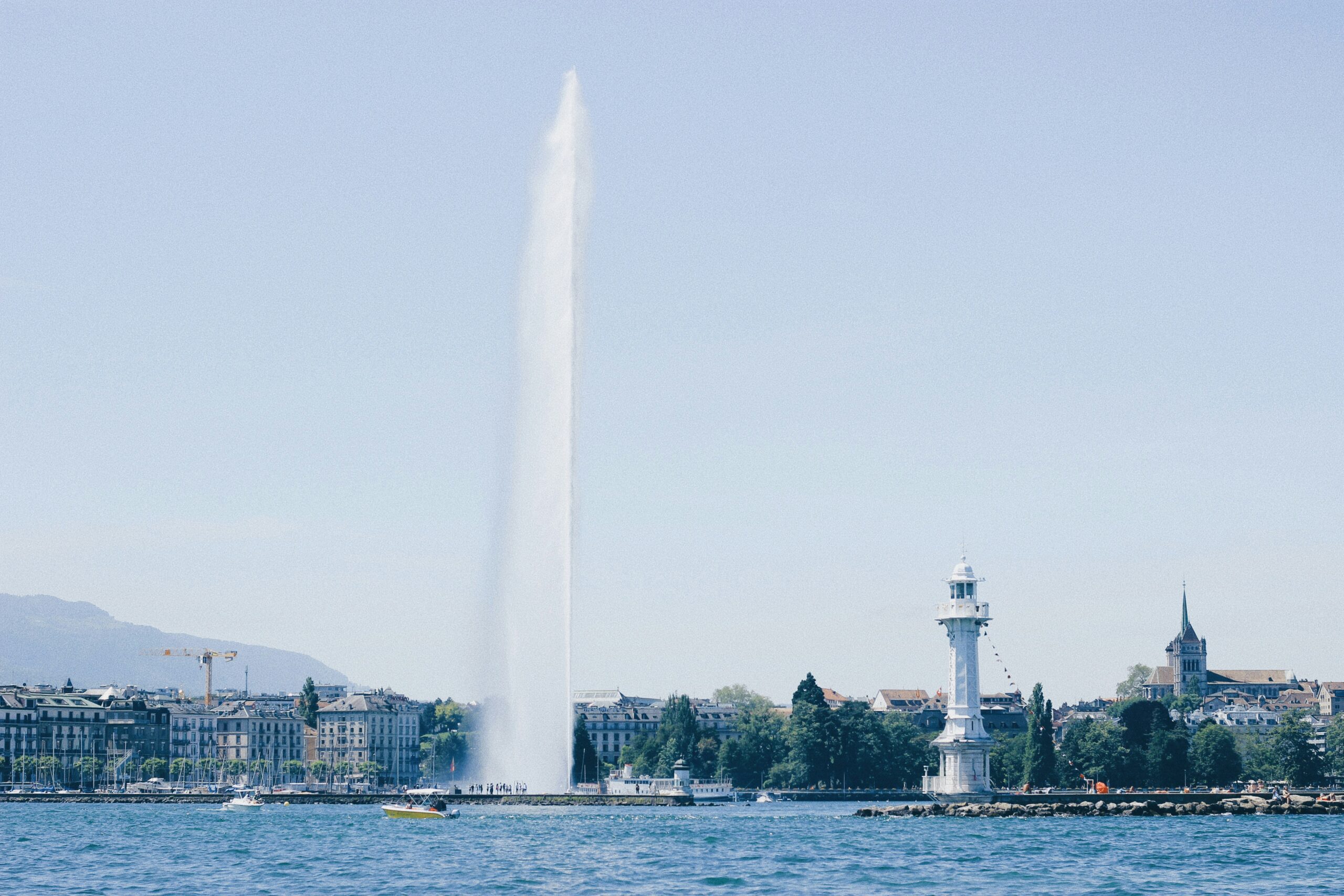 tall white water sprays from a fountain in Geneva